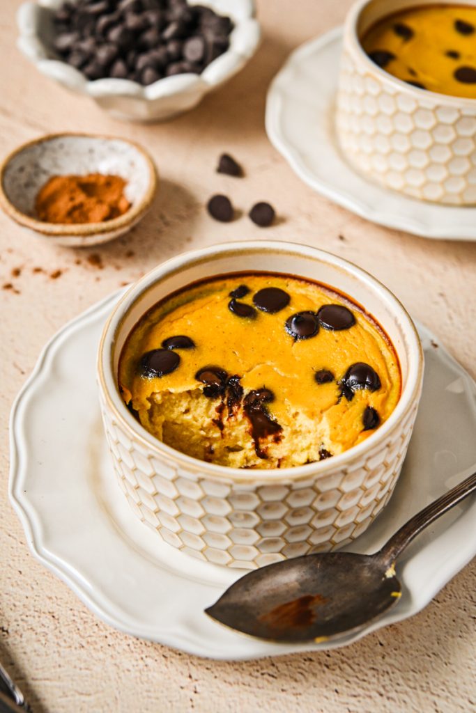 Baked pumpkin banana yogurt in a ramekin with golden top and melted chocolate chips
